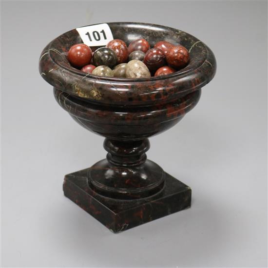 A Cornish serpentine urn and miniature eggs height 15cm